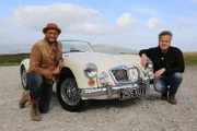 WALES - Car SOS presenters Tim Shaw and Fuzz Townshend pose with a pristine example of an MGA, a classic British motor car.