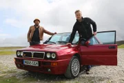 Tim Shaw and Fuzz Townshend stand with a pristine example of the Lancia Integrale before they take it for a test drive around the Brecon Beacons.