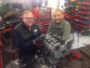 Car SOS presenter Fuzz Townshend poses with the Lancia Integrale Evo II as it is looked over by Greg Healey.