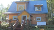 Exterior, front door of house with steps, tongue and groove siding with blue metal roof, Michael Doty, Casey Doty, Violet Drive House, Fairbanks, Alaska, Great American Country, GAC