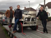 Abergavenny, Wales - Fuzz Townshend and Tim Shaw stand with Adam White after his brother's Toyota FJ40 Land Cruiser is loaded on to the trailer.