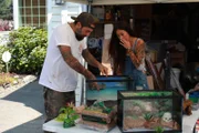 Antonio Ballatore and Grace Lee work on animal tanks.