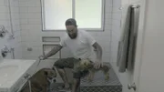 Antonio Ballatore bathing the dogs.