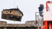 Behind the scenes of the production crew filming a segment of the house in the air.