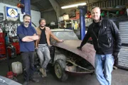 Car SOS presenters Tim Shaw and Fuzz Townshed stand are with DS specialist Jamie at his workshop in Barnet.