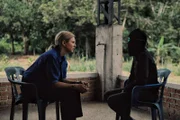 Mariana van Zeller (L) conducts an interview about cocaine trafficking.