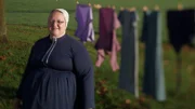 Mary in front of the clothesline.