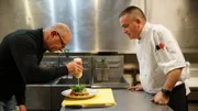 Chef Robert Irvine shows Ed Zeims, owner/chef of Z's Fish House, how to cook the new entrées that will be part of the restaurant's new menu, as seen on Restaurant: Impossible, season 18.