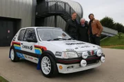 Warwickshire, United Kingdom - Car SOS presenters Tim Shaw and Fuzz Townshend stand with 1964 Monte Carlo rally champion Paddy Hopkirk at the British Motor Museum at Gaydon.