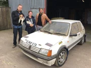 BRISTOL, UK - Car SOS presenters Tim Shaw and Fuzz Townshend pose with Katie who has nominated her dads Peugeot 205 to be given the Car SOS treatment.