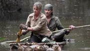 Ruth and Myke Hawke paddling on the raft that they made in Peru episode.