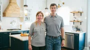 Homeowners Ken and Kelly Downs in their newly renovated kitchen, as seen on Fixer Upper.