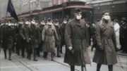 In April 1918, an influenza pandemic of unknown origin begins to ravage the world. In less than a year it will kill 25 million people. These American troops on parade are wearing masks intended to protect them from infection.  (photo credit:  ECPAD)
