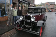 Fuzz Townshend, Craig Farr nominee, Tom Farr, nominator, Tim Shaw next to the Ford Model A at the Black Country Museum.