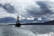 Orkney, Scotland - Karin dive boat sailing across Scapa flow in Orkney Scotland. On board technical deep sea diver Daniel Stevenson prepares for decent to investigate the German wreck SMS Margraf.