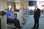 Owner John Syragakis shows host Anthony Melchiorri the benefits of working out, as seen on Travel Channel's Hotel Impossible.