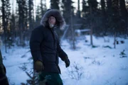 Tyler walks in the snow.