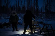Tyler and Ashley works in the dark.