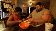 Gideon preparing food with his son Jonathan.