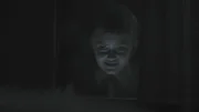 Boy looks out the window.