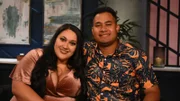 A medium shot of Kalani and Asuelu smiling for the camera.