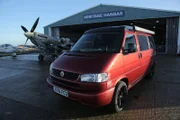 The VW T4 next to a Spitfire outside Biggin Hill Heritage Hangar.