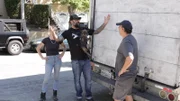 Host Antonio Ballatore with his dog Edie and build crew member Christina Ray speak with furniture importer Zaid Al-Hakim.