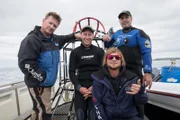 Marine biologist Chris Fallows, natural history filmmaker Jeff Kurr, shark expert Dickie Chivell, and wildlife photographer Dave Abbott pose for the camera on their quest to find the legendary great white shark Fred.