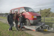 Tim, Fuzz and Vicky pose in front of Jon's VW T4.