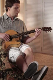 Brinn playing guitar.