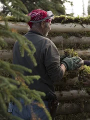 Heimo and Edna working on their cabin.