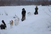 Tyler and Ashley Selden sleigh riding through snow.