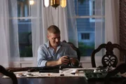 Kevin Dunlap cleans his collection of guns.