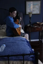 Andrew playing guitar.