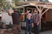 Host ANTONIO BALLATORE makes a grand gesture as homeowners SCOUT RASKIN and ROBBY DEFRAIN look on.