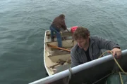 L-R: Matt Brown and Gabe Brown working on skiff.