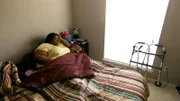 June laying in bed.