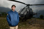 Manang Air pilot Ryan Skorecki with Manag Air B3 helicopter at Lukla helipad, Nepal.
