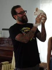 Antonio Ballatore holds up Giuseppe the chinchilla.