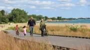 Busy parents Prashant and Marci enjoy an afternoon stroll on the lake with their three young kids, as seen on HGTV's Beach Hunters.