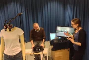 Paul Giamatti, left, getting prepped for doll experiment with Catherine Preston.  Relates to proprioception which is being changed in this doll experiment.â€¨â€¨(photo credit:  Asylum Entertainment)