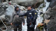 L-R: Carlos Minor conversing with Dustin Hurt next to the water