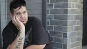 David sits on his front porch.