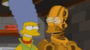 Endlich glücklich: Anders als der geklonte Homer ist der Roboter-Homer (r.) eine ganz andere Persönlichkeit als das Original und hilft Marge (l.) sogar bei der Hausarbeit ...