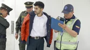 BOGOTA, Colombia - Police officers arrest an accountant. (Photo Credit: National Geographic Channels/Mario Lazcano)