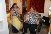 Rena helping Lee pack to go to the hospital.