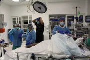 Doctors preparing Liz for lymphedema removal surgery.