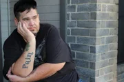David sits on his front porch.