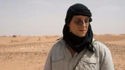 Host Bear Grylls on location in the Sahara desert with charcoal under his eyes to reduce the glare.