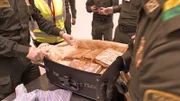 BOGOTA, Colombia - Officers inspect a lost luggage with cocaine.
